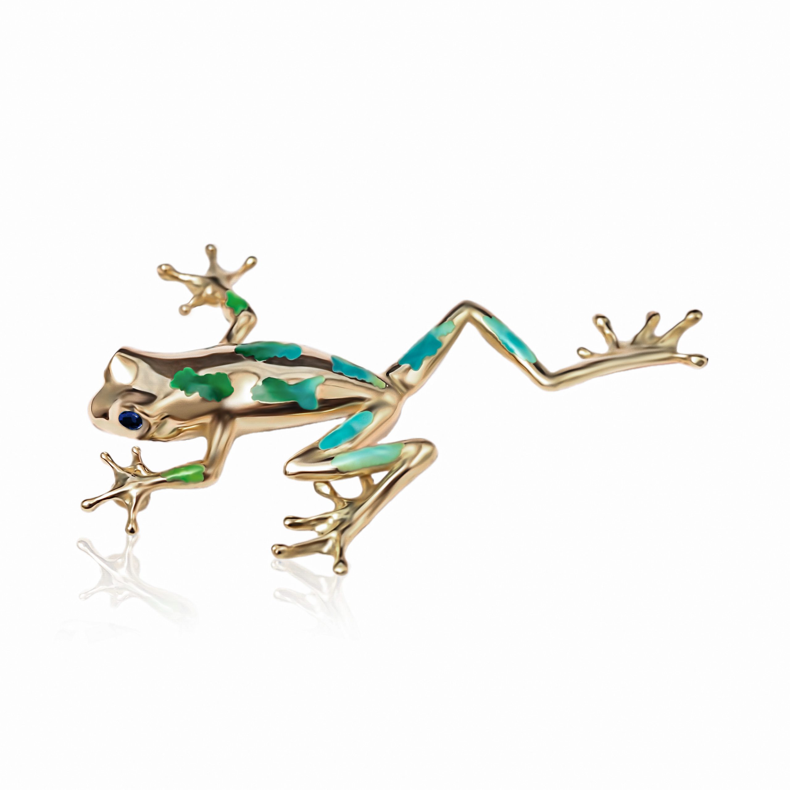 Broche de rana en oro 18K con esmaltes al fuego opalescentes y zafiros talla brillante, diseño artesanal inspirado en la naturaleza. broche rana oro 18 quilates